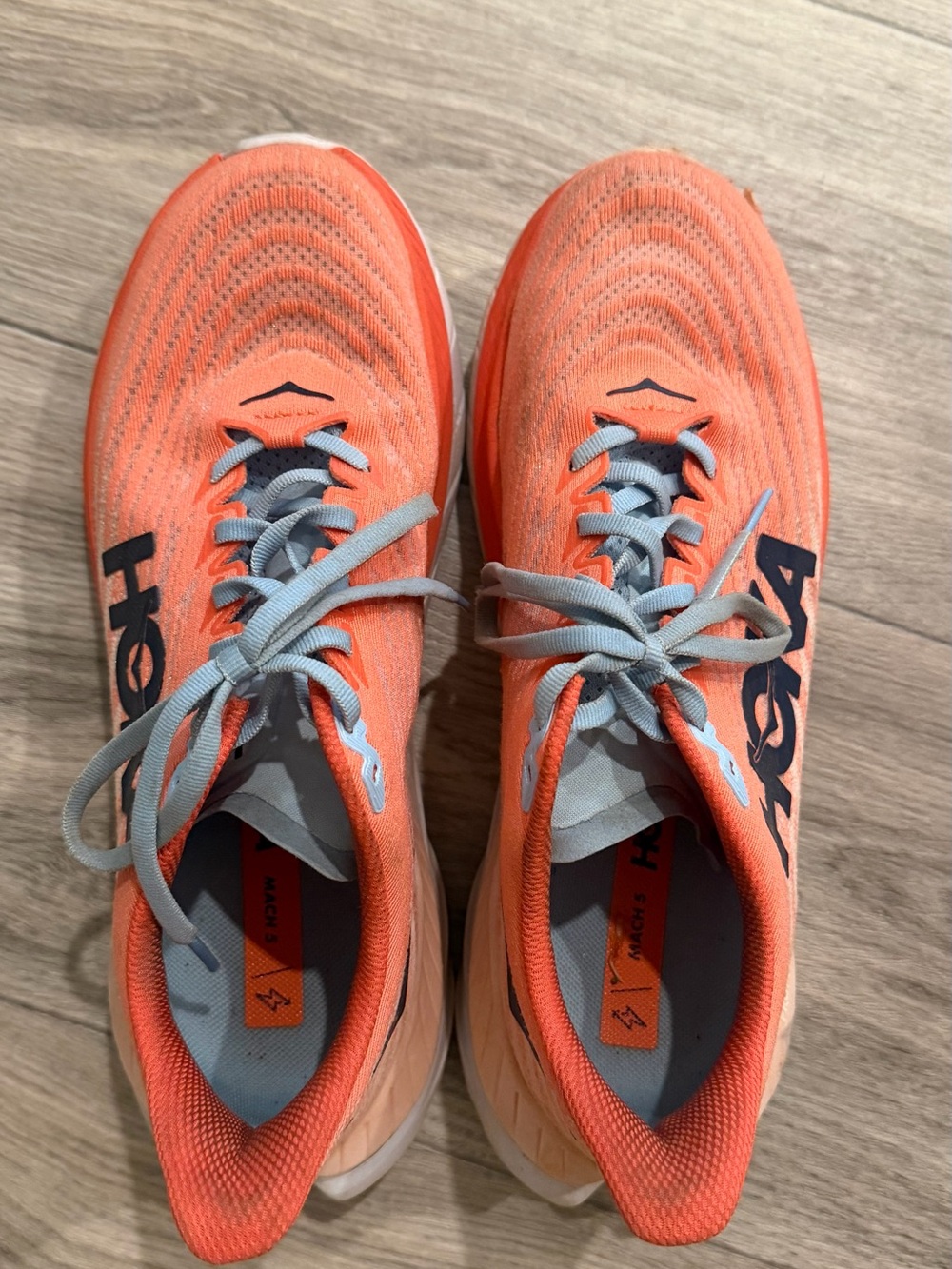 Hoka Orange Running Shoes with Light Blue Accents